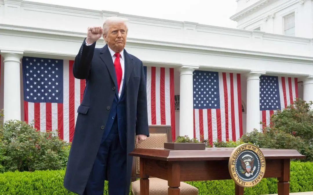 US President Donald Trump pumps his fist after signing an executive order after delivering remarks on reciprocal tariffs during an event in the Rose Garden entitled 'Make America Wealthy Again' at the White House in Washington, DC