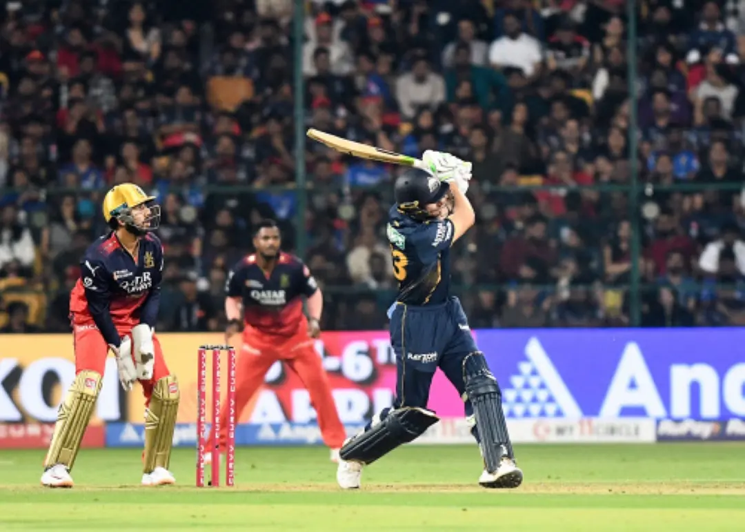 Gujarat Titans' Jos Buttler plays a shot during the Indian Premier League 2025 match against Royal Challengers Bengaluru, at M. Chinnaswamy Stadium in Bengaluru. | Photo: ANI