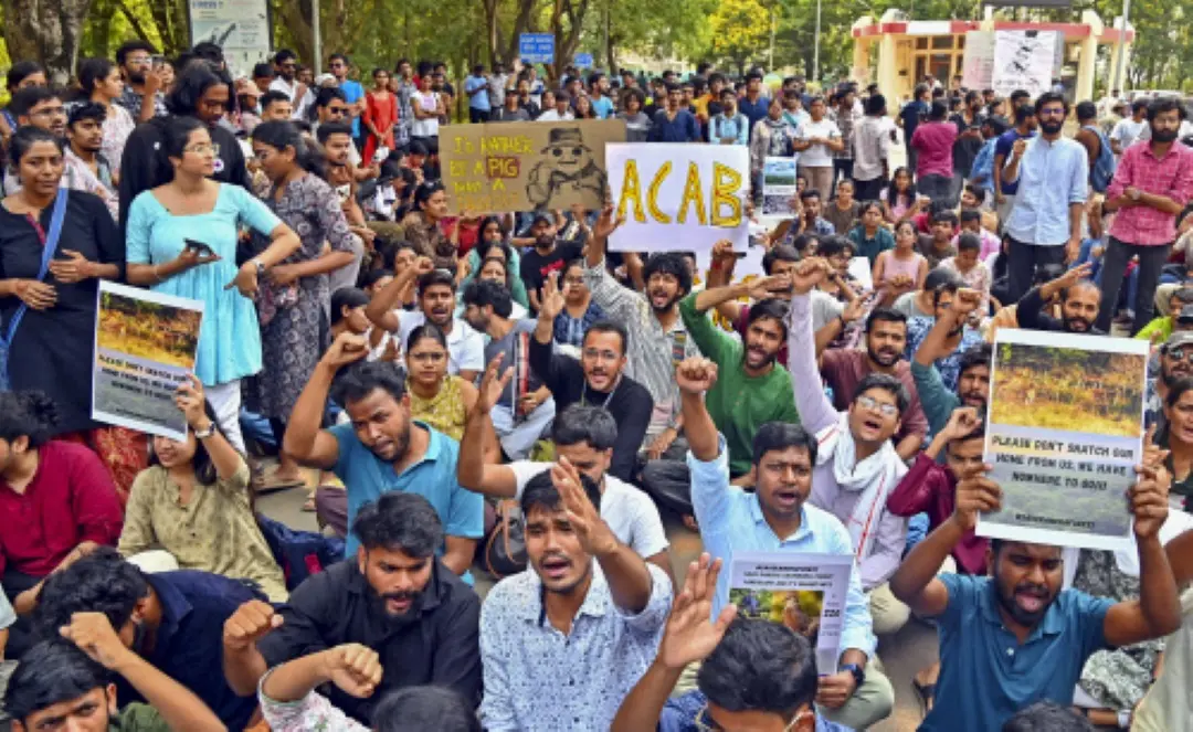 Students of the University of Hyderabad raise slogans during their protest demanding the removal of police personnel and earth-moving machinery from the campus, in Hyderabad. | Photo: PTI