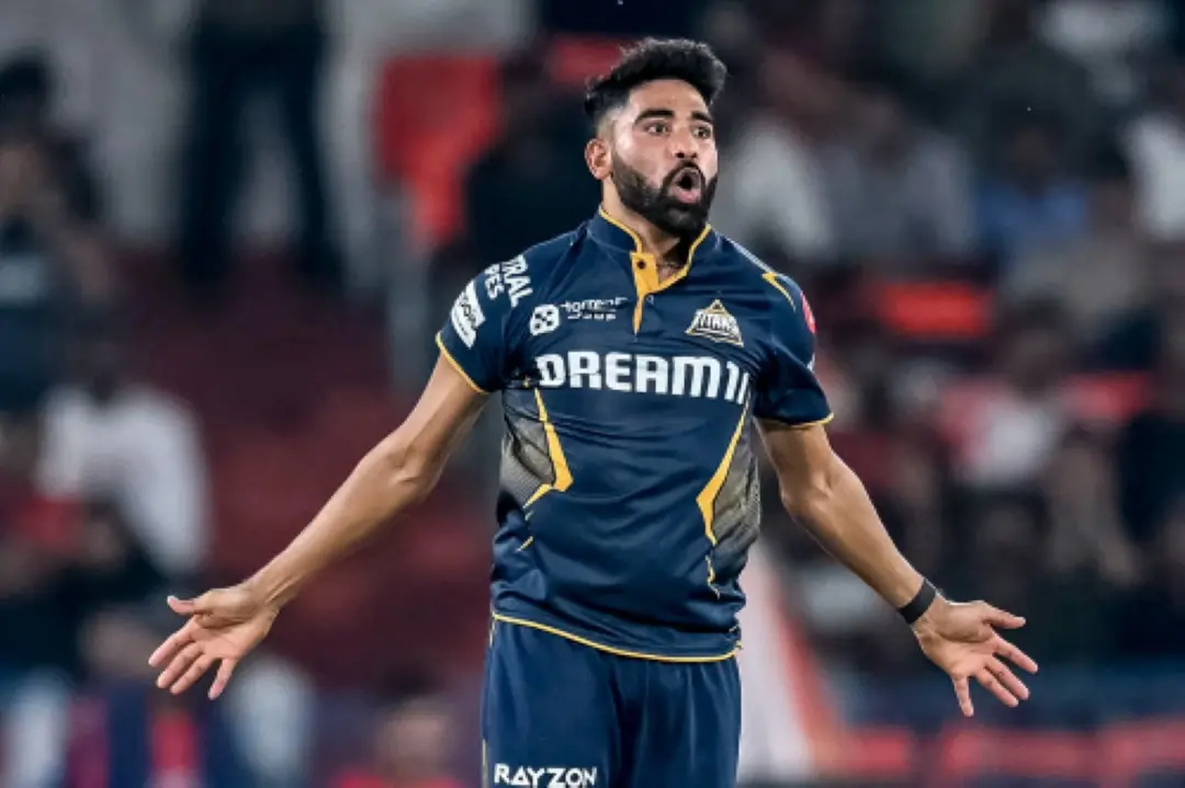 Gujarat Titans' Mohammed Siraj celebrates after taking the wicket of Sunrisers Hyderabad's Simarjeet Singh during the Indian Premier League (IPL) Twenty20 cricket match between Sunrisers Hyderabad and Gujarat Titans at the Rajiv Gandhi International Stadium in Hyderabad. | Photo: AFP