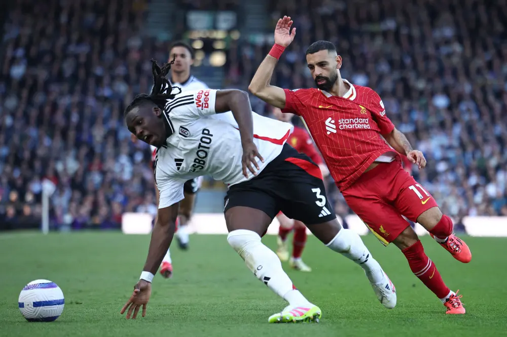 Calvin Bassey (L) vies with Liverpool's Mohamed Salah (R) during the match | AFP