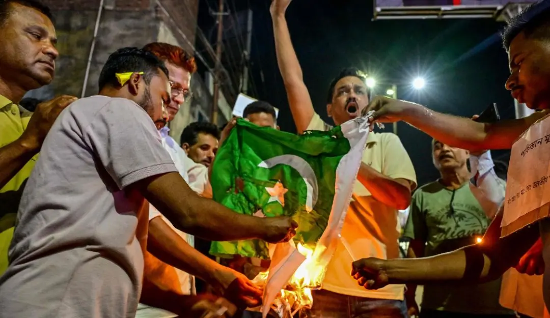 Supporters of Sadou Asom Goria-Moria-Desi-Jatiya Parishad burn Pakistan's national flag in Guwahati (Photo: AFP)