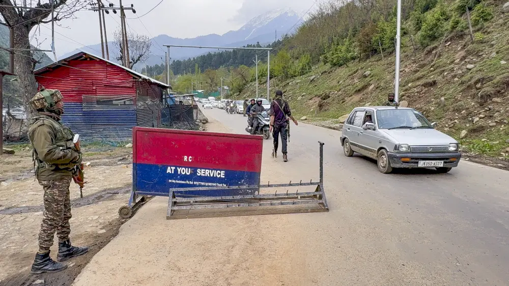 Security personnel stand guard at a checkpoint, in Anantnag district | PTI