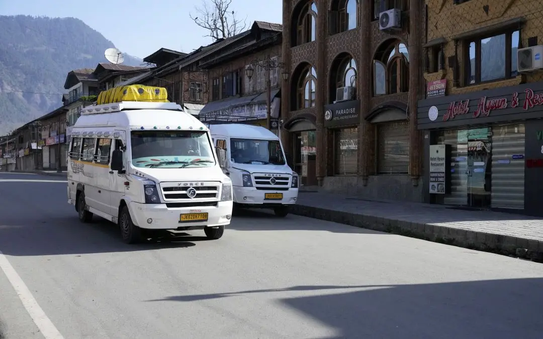 Vehicles carrying tourists leave Pahalgam the morning after the terrorist attack