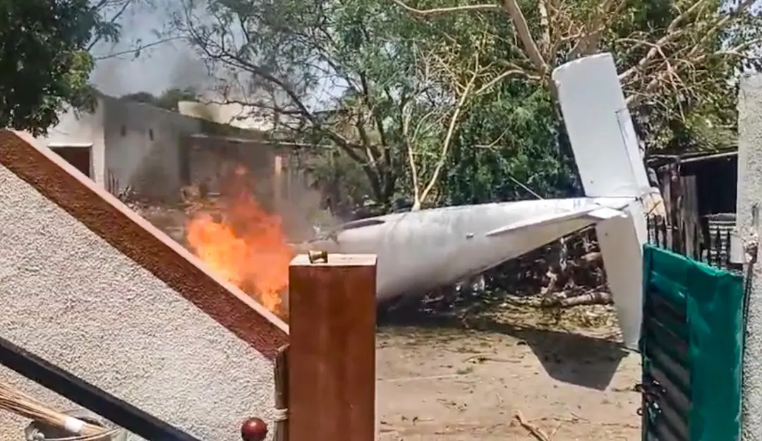 Flame and smoke rise up after a private company plane after it crashed, in Amreli, Gujarat. | Photo: PTI