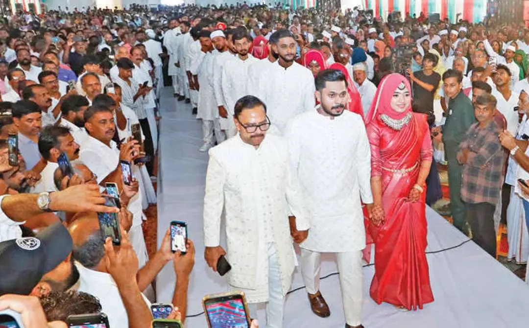 Araykkal Ashraf walks towards the decorated platform where the wedding of his son Muhammad Faizal and Sania, to be held along with 25 girls from poor families. | Photo: Ajith Shankaran