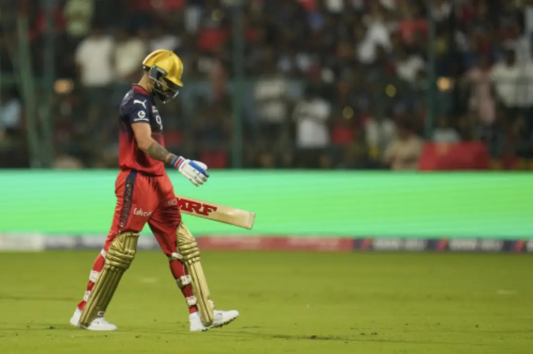 Royal Challengers Bengaluru's Virat Kohli walks off the field after losing his wicket during the Indian Premier League cricket match between Royal Challengers Bengaluru and Punjab Kings at Chinnaswamy Stadium in Bengaluru. | Photo: AP