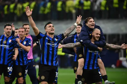Inter Milan's Argentine forward Lautaro Martinez celebrates with teammates Inter Milan's Italian defender Federico Dimarco and Inter Milan's Italian midfielder Nicolo Barella at the end of the UEFA Champions League quarter final second leg football match between Inter Milan and Bayern Munich at the San Siro stadium in Milan on April 16, 2025. | Photo: AFP