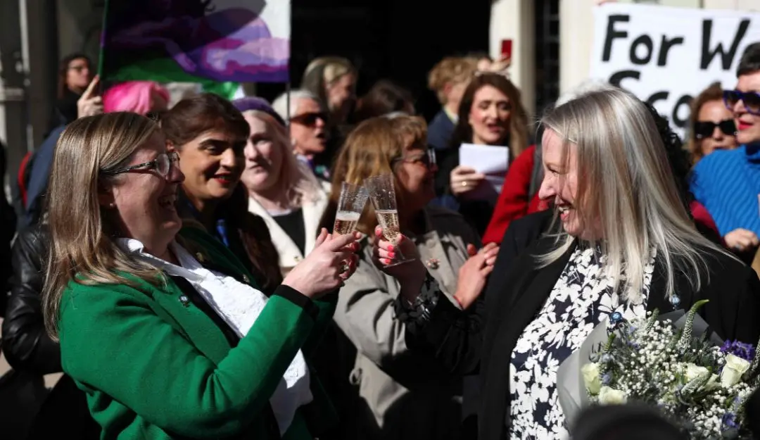 Susan Smith (L) and Marion Calder, directors of For Women Scotland celebrate outside Britain's Supreme Court in London on April 16, 2025, following the court's ruling on how to define a 'woman'.