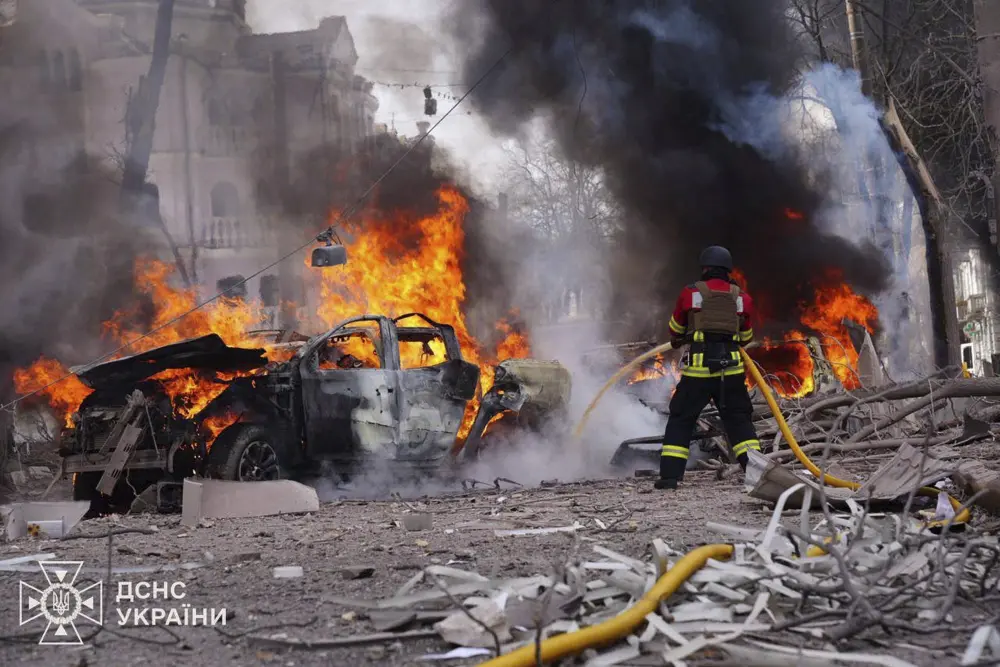 Firefighters put out the fire following Russia's missile attack that killed at least 20 civilians in Sumy | AP