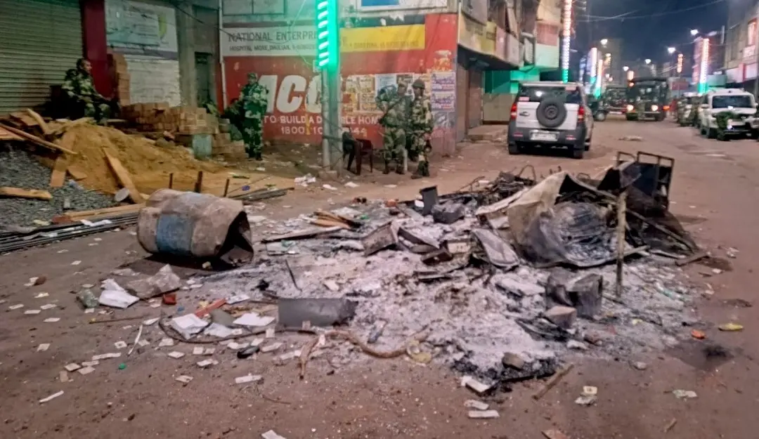 Security personnel keep a vigil at an area amid protests over the Waqf (Amendment) Act, in Murshidabad district, West Bengal