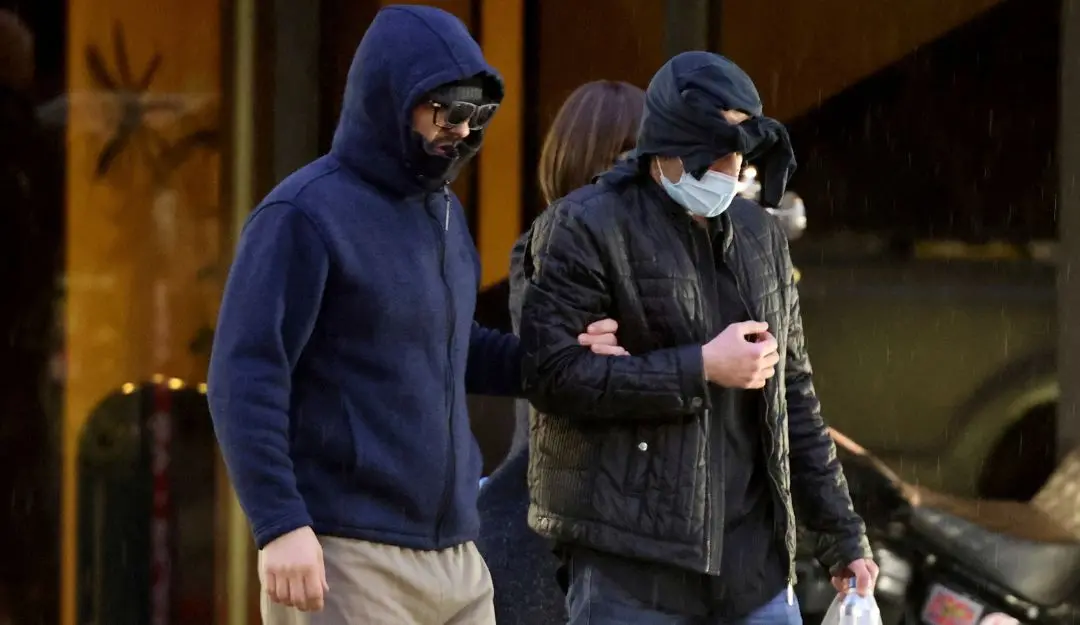 Former FBI informant Alexander Smirnov, left, walks out of his lawyer's office in downtown Las Vegas | File Photo: AP