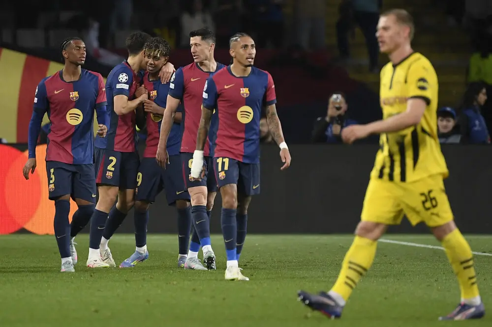 Lamine Yamal (C) celebrates with teammates scoring his team's fourth goal | AFP