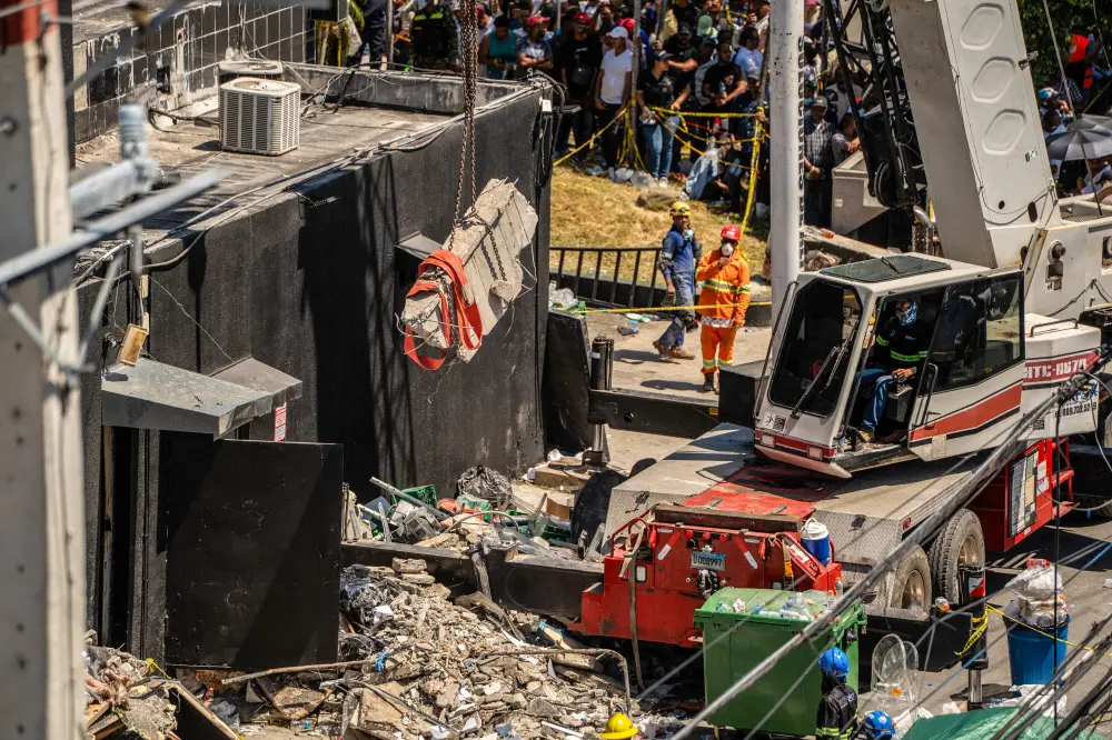 Personnel from civil defense and firefighters work at the Jet Set nightclub following the collapse of its roof in Santo Domingo | AFP