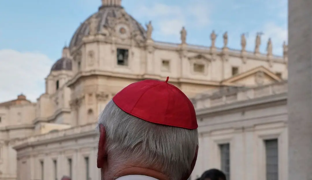 St Peter's Basilica is seen in the background as a cardinal arrives for a college of cardinals' meeting, at the Vatican, Monday, April 28, 2025.