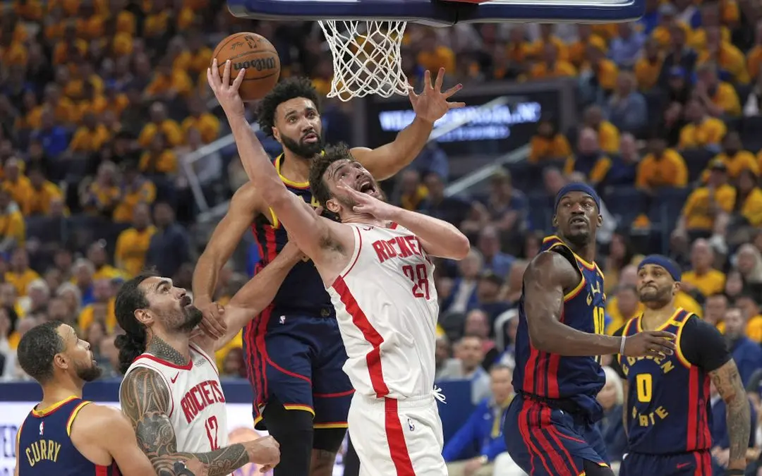 Houston Rockets centre Alperen Sengun (28) shoots while defended by Golden State Warriors center Trayce Jackson-Davis, rear, during the second half of Game 4 of an NBA basketball first-round playoff series Monday, in San Francisco. AP Photo/Godofredo A. V&aacute;squez