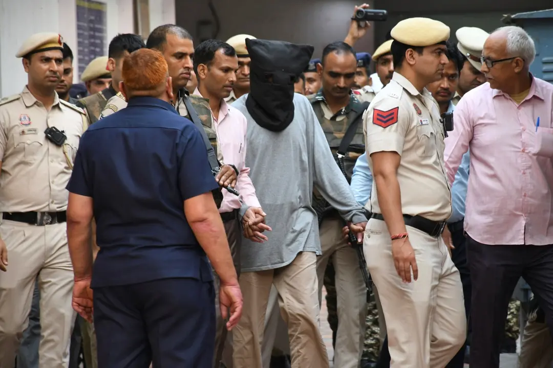 Tahawwur Hussain Rana, escorted to court in a hood in New Delhi | AP