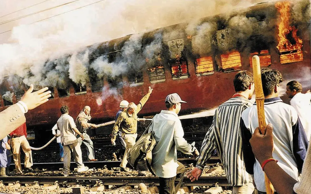 File photo of the Sabarmati Express coach set on fire by a mob in Godhra on Februar 27, 2002. Photograph: AP Photo/str