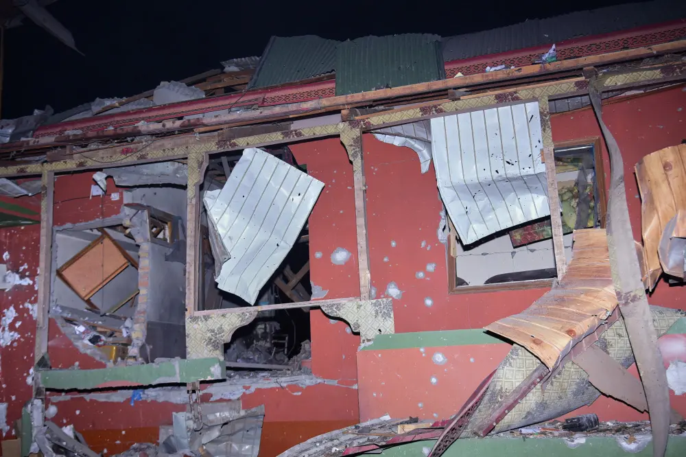 A damage portion of a building is seen at a site of a suspected Indian missile attack near Muzaffarabad | AP