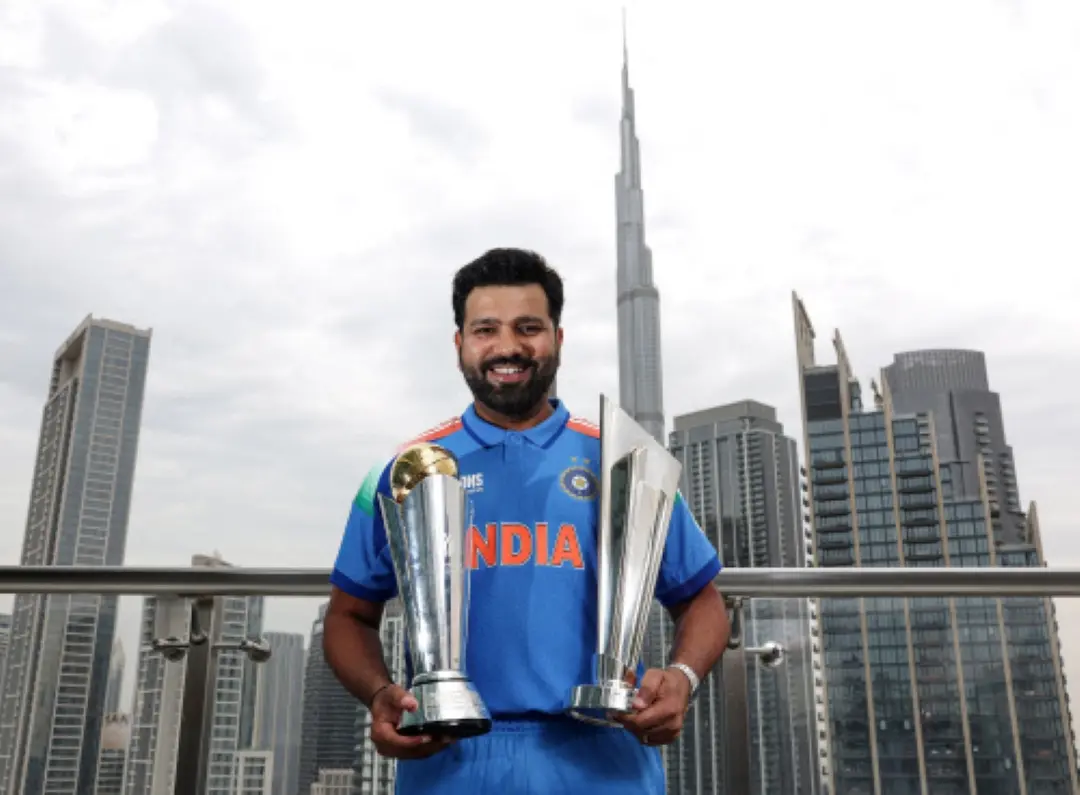 India's captain Rohit Sharma poses for a picture with the ICC Champions Trophy 2025 and T20 World Cup 2024 trophy, in Dubai. | Photo: ANI