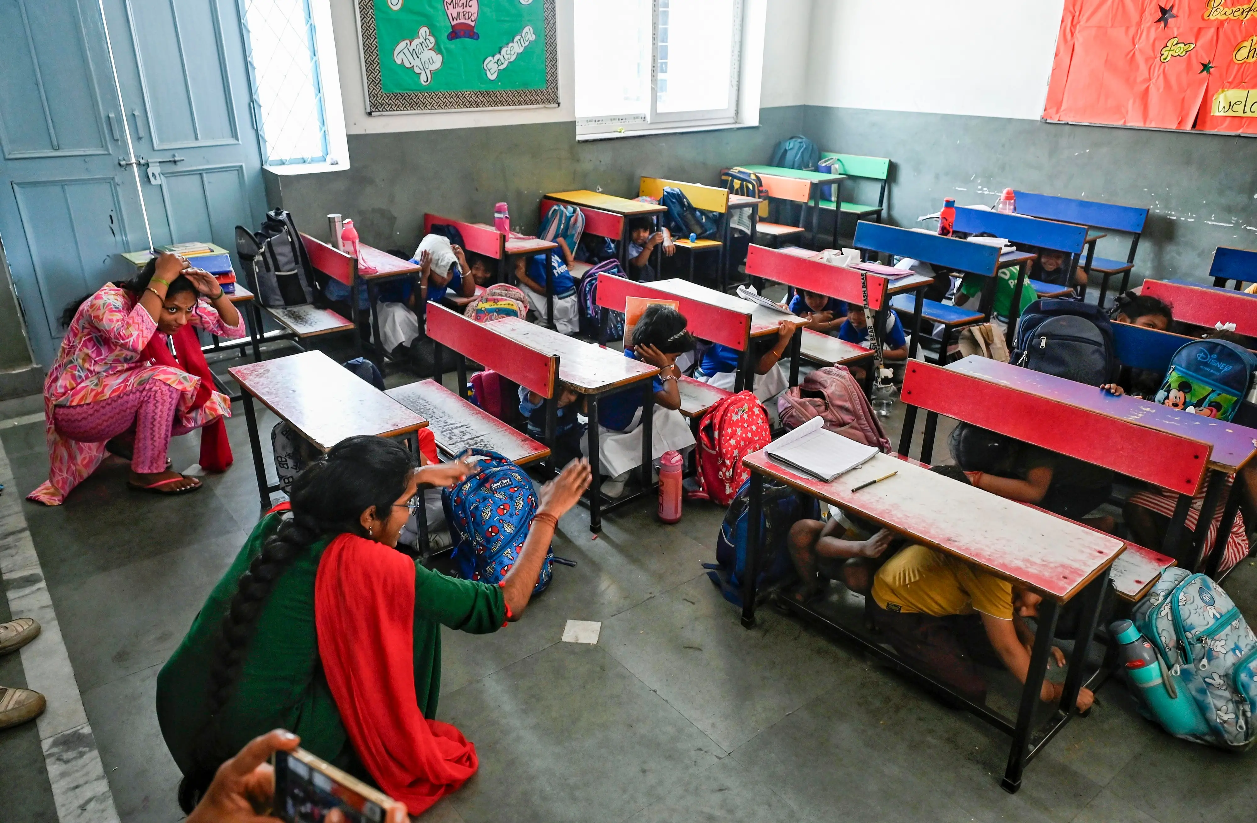 School students take part in a nationwide civil defense mock drill, at DTEA Sr. Sec. School, Lodhi Estate in New Delhi. | Photo: PTI