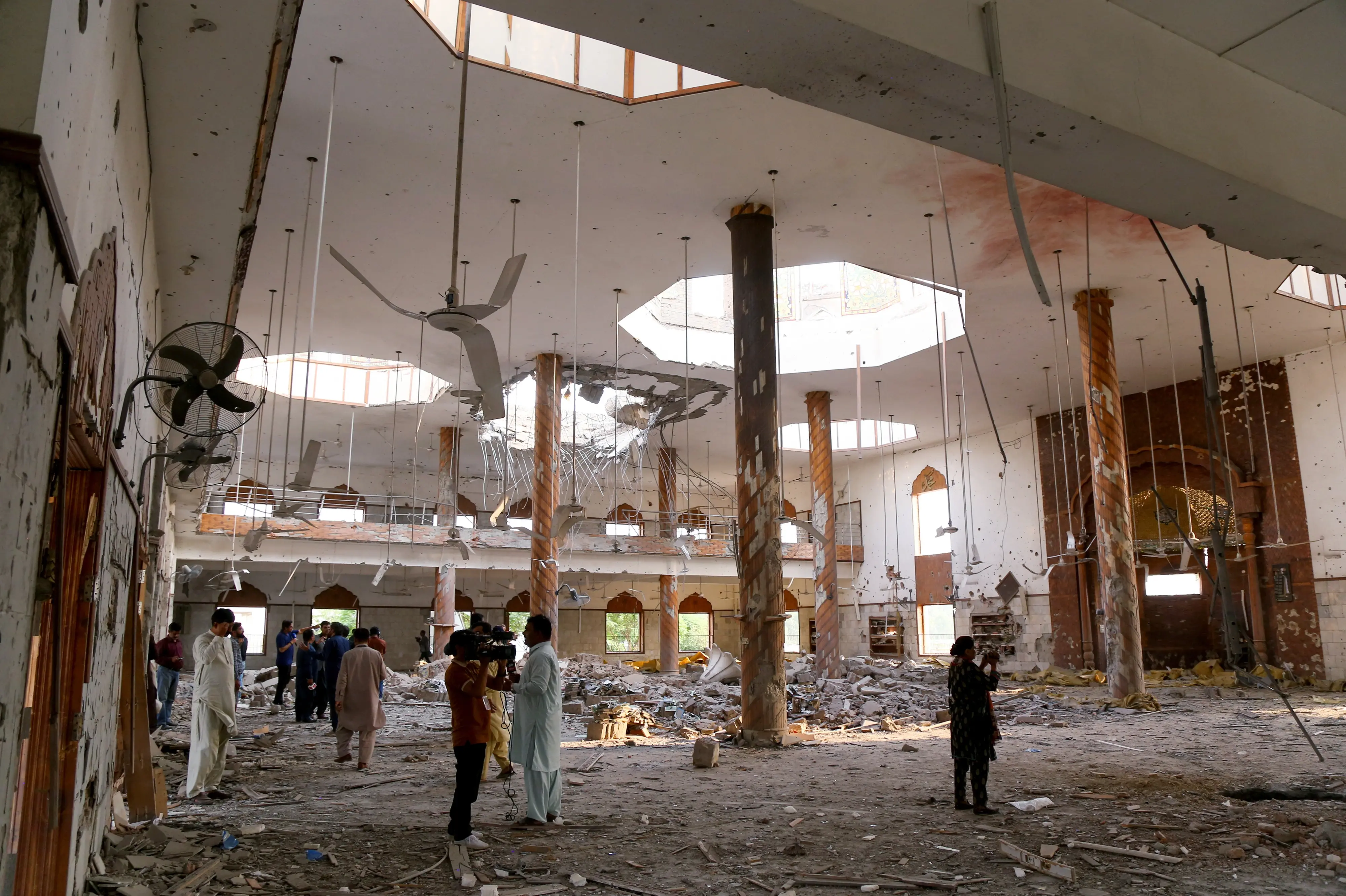 Members of the media film the inside of a building after it was hit by an Indian strike in Bahawalpur on Wednesday | ANI