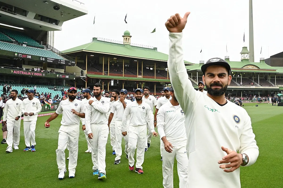 Virat Kohli (R) gestures as the India team celebrates their series win on the fifth day of the fourth and final cricket Test against Australia at the Sydney Cricket Ground in Sydney on January 7, 2019. | File photo: AFP