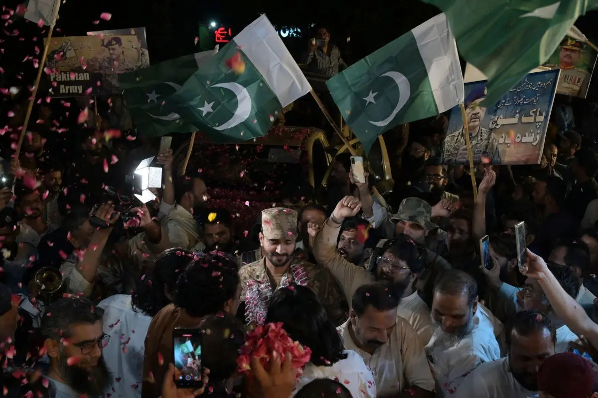 People throw rose petals at the army personnel to express solidarity with Pakistan's armed forces during a rally in the cantonment area (Photo: AFP)