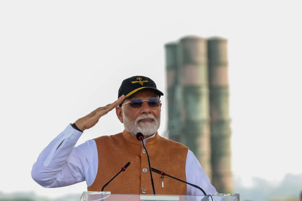 Prime Minister Narendra Modi addresses personnel during his visit to Adampur Air Base in Jalandhar on Tuesday, with the S-400 air defence system seen in the background.| Photo: PTI