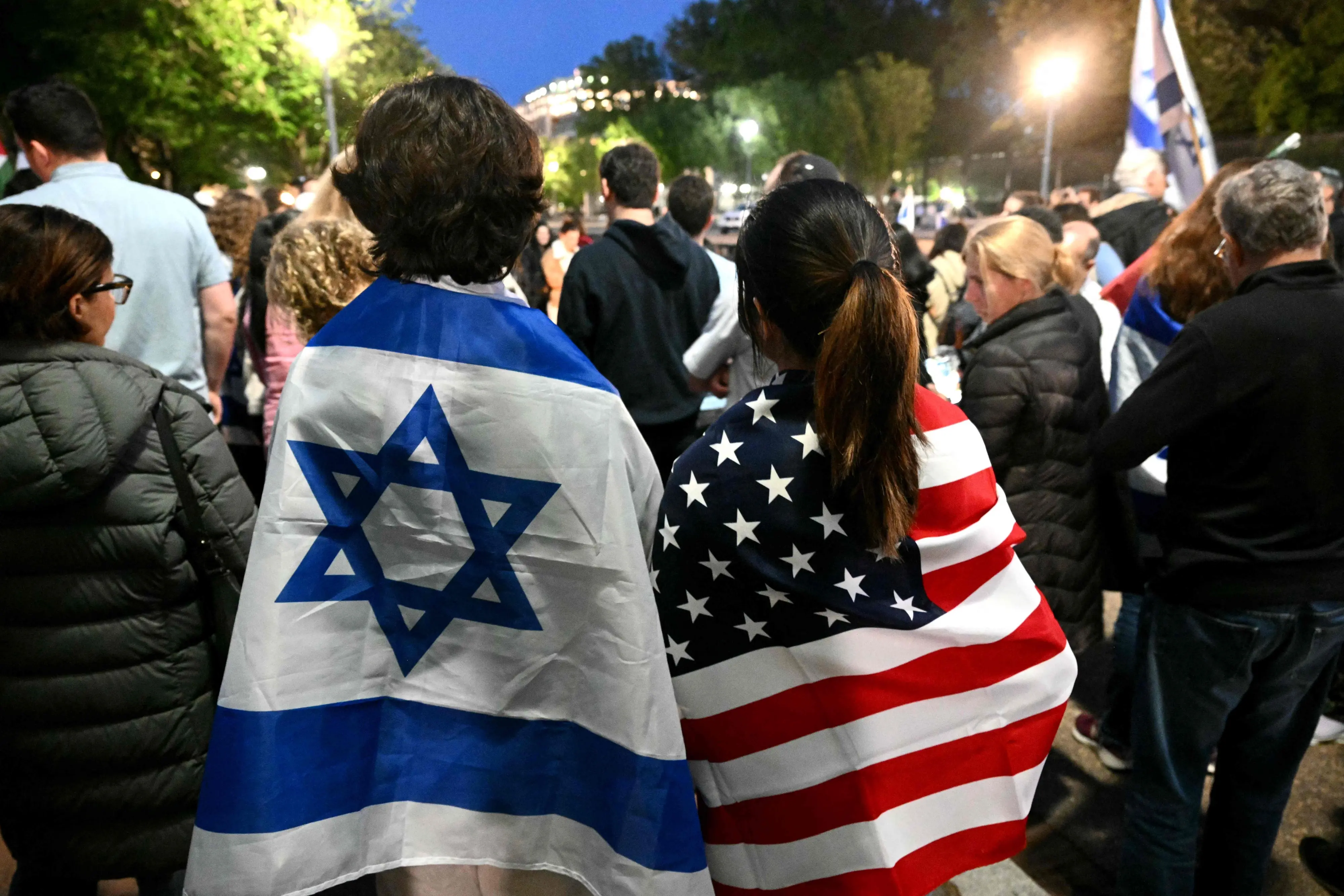 People attend a candlelight vigil at Lafayette Square across from the White House in Washington, DC on May 22, 2025, following a shooting that left two people dead. | AFP