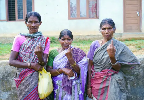Women voters show their ink-marked fingers after casting their votes during the second phase of the Lok Sabha Polls, at a polling station in Idukki on Friday. (ANI Photo)
