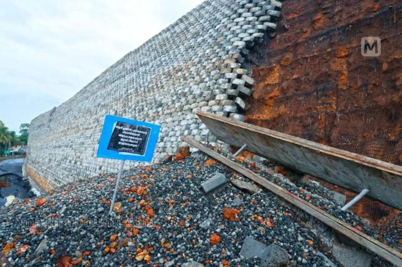 A protest placard placed at the site where the road caved in at Kooriyad in Malappuram. | Photo: MBI