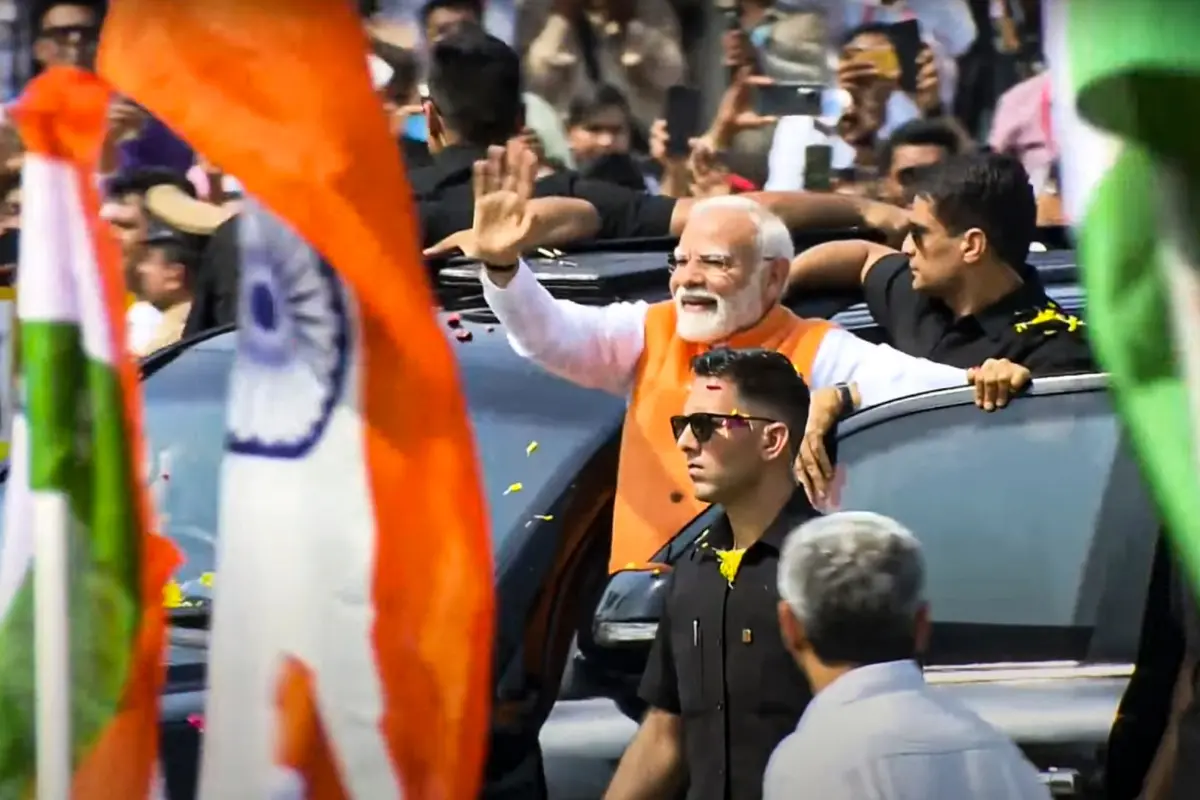 Prime Minister Narendra Modi waves at supporters during roadshow in Vadodara, Gujarat | Photo: PTI