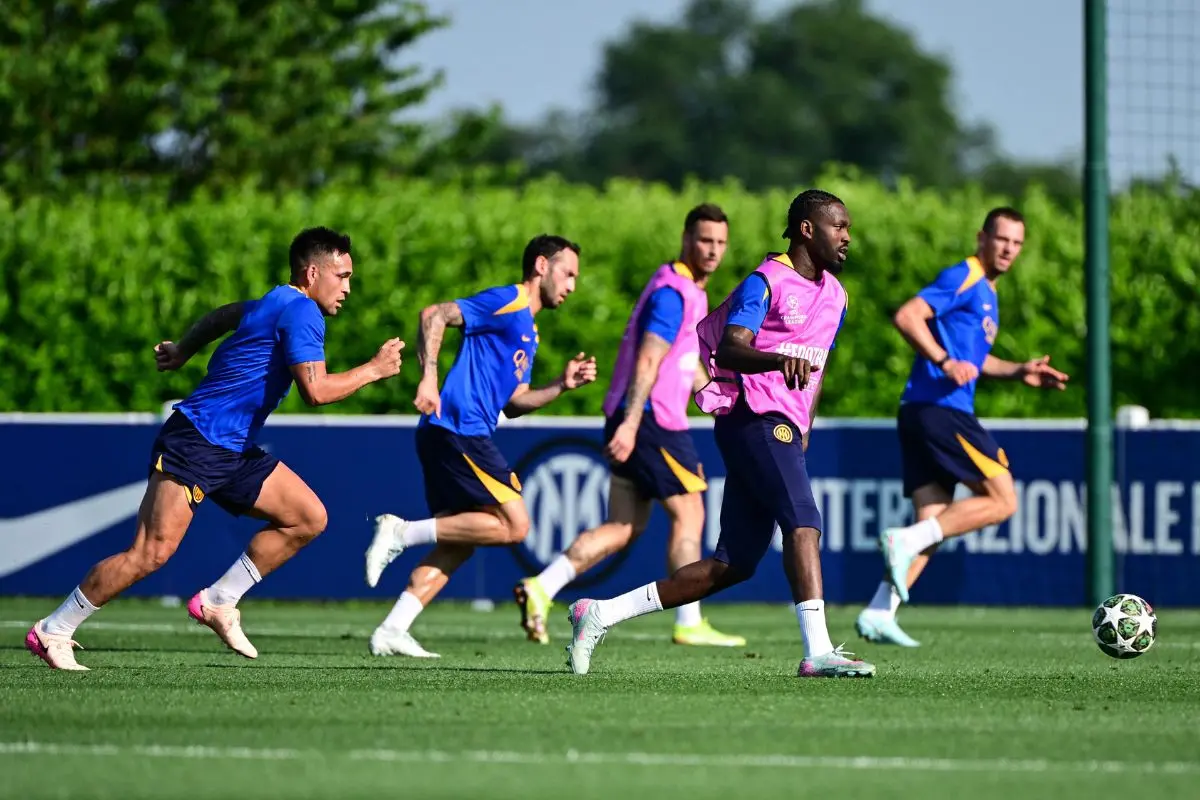 Inter Milan's French forward Marcus Thuram controls the ball in front of Inter Milan's Argentine forward Lautaro Martinez during a training session as part of the club's media day ahead of the UEFA Champions League final football match against Paris Saint-Germain (PSG), in Appiano Gentile, on May 26, 2025. | Photo:  AFP