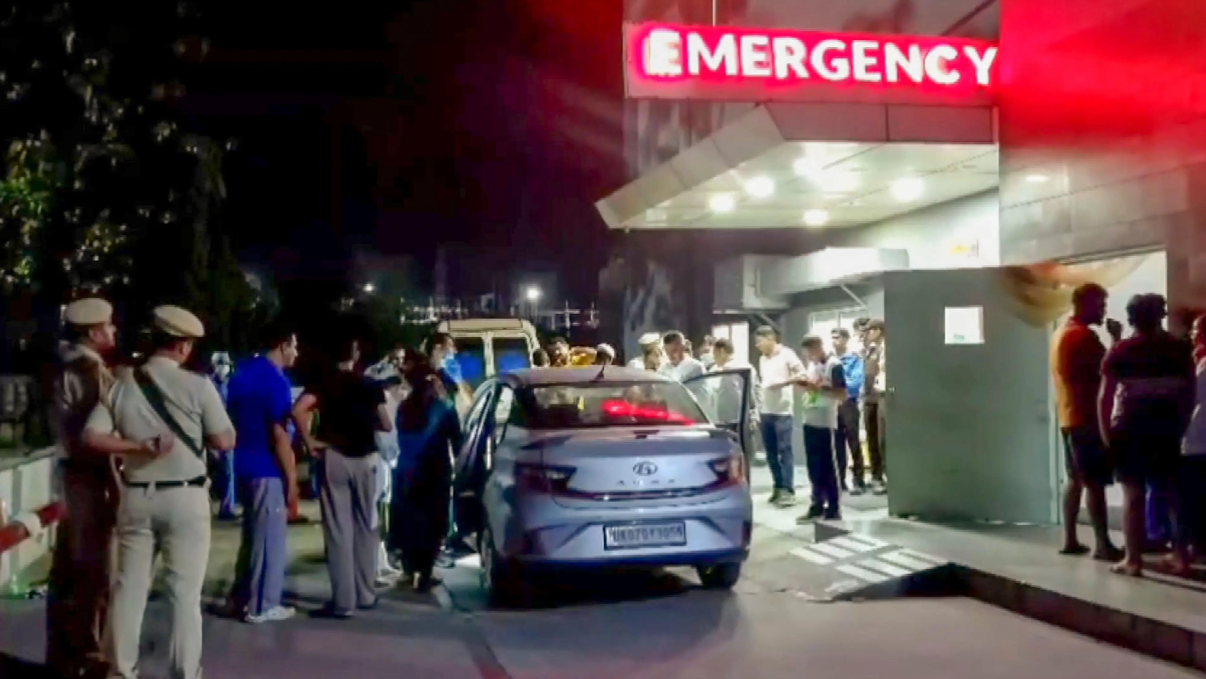 Police and officials investigate at the site after seven members of a family from Dehradun allegedly consumed poison and died in a car, in Panchkula, Haryana. | Photo: PTI