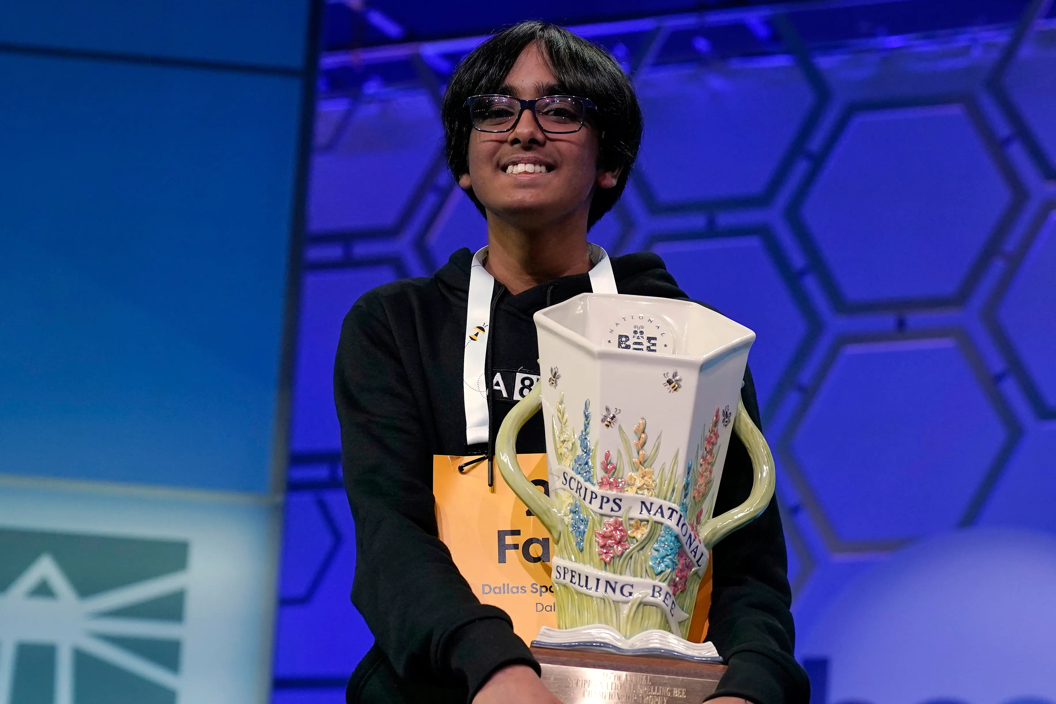 Faizan Zaki holds the trophy after winning the 2025 Scripps National Spelling Bee | Photo: Jose Luis Magana/AP