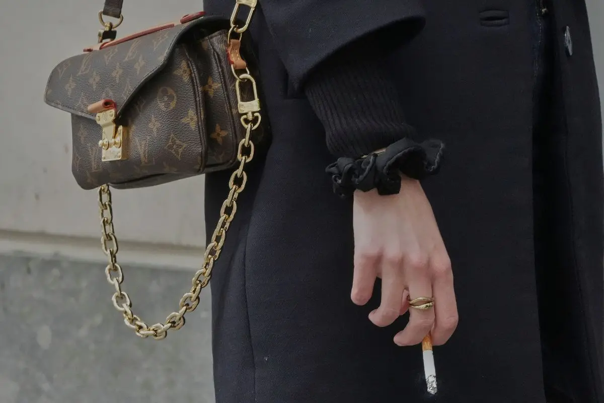 A woman holds a cigarette during a break in Paris, Wednesday, May 28 2025 (Photo: AP)