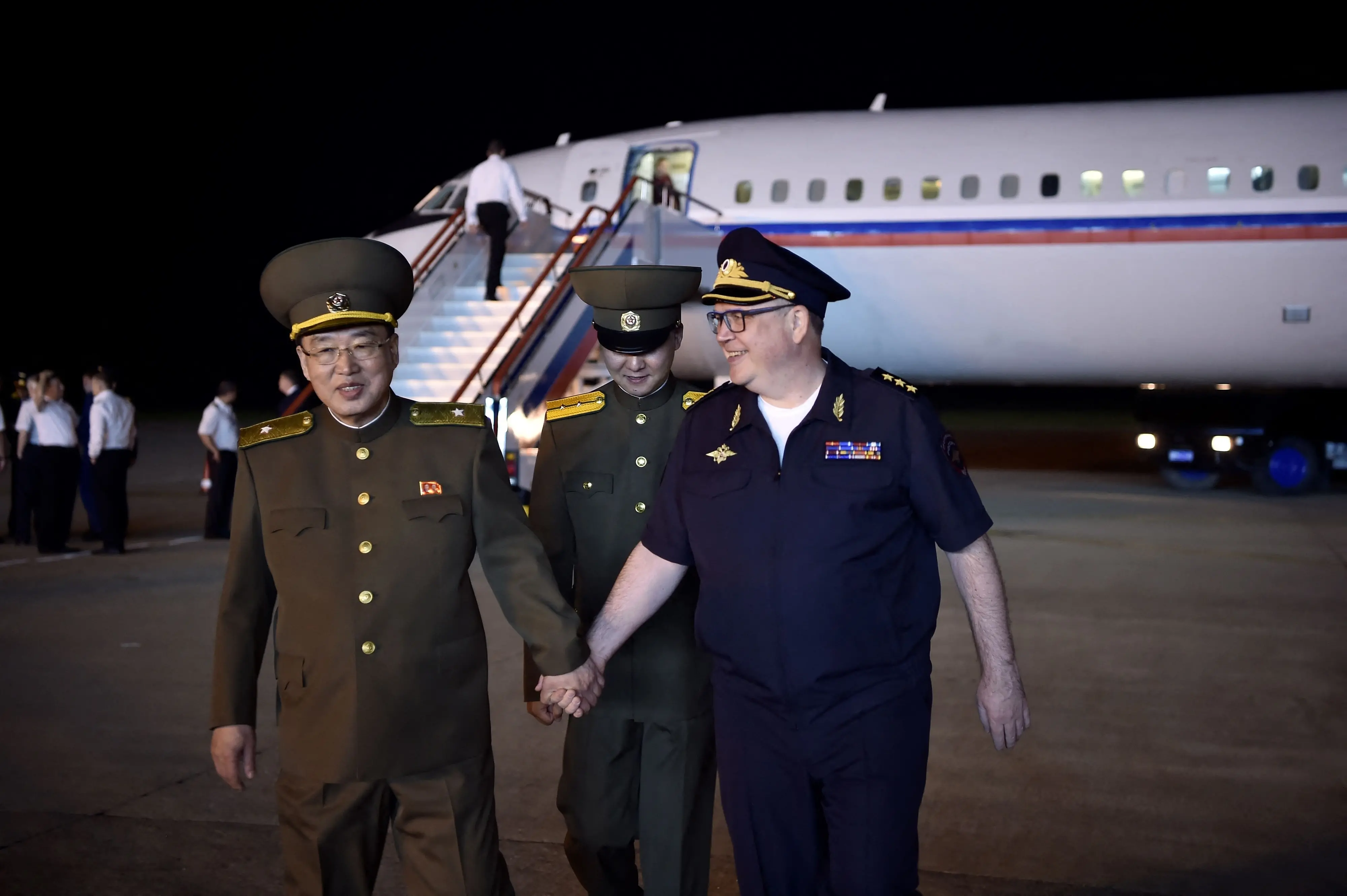 Vitaly Shulika (R), Russian vice minister of Interior, is greeted by Ri Song Chol, vice minister of North Korea, at Pyongyang International Airport in Pyongyang on May 26, 2025. | File Photo: KIM Won Jin / AFP