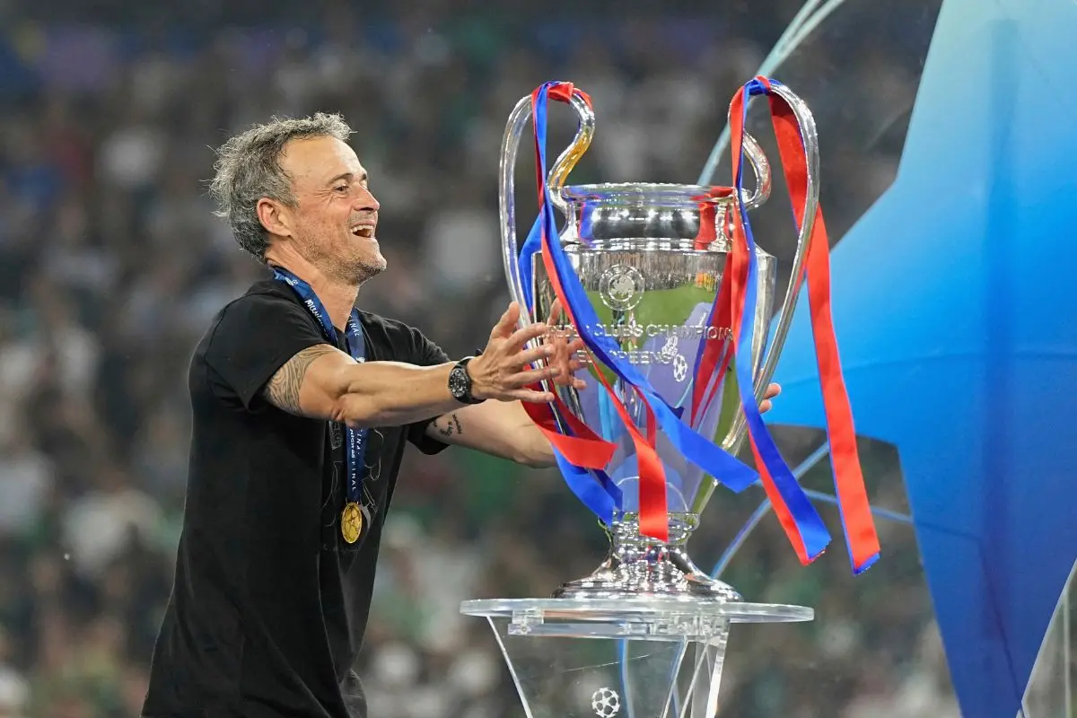 PSG's head coach Luis Enrique touches the trophy after winning the Champions League final soccer match against Inter Milan at the Allianz Arena in Munich, Germany, Saturday, May 31, 2025. | Photo: AP