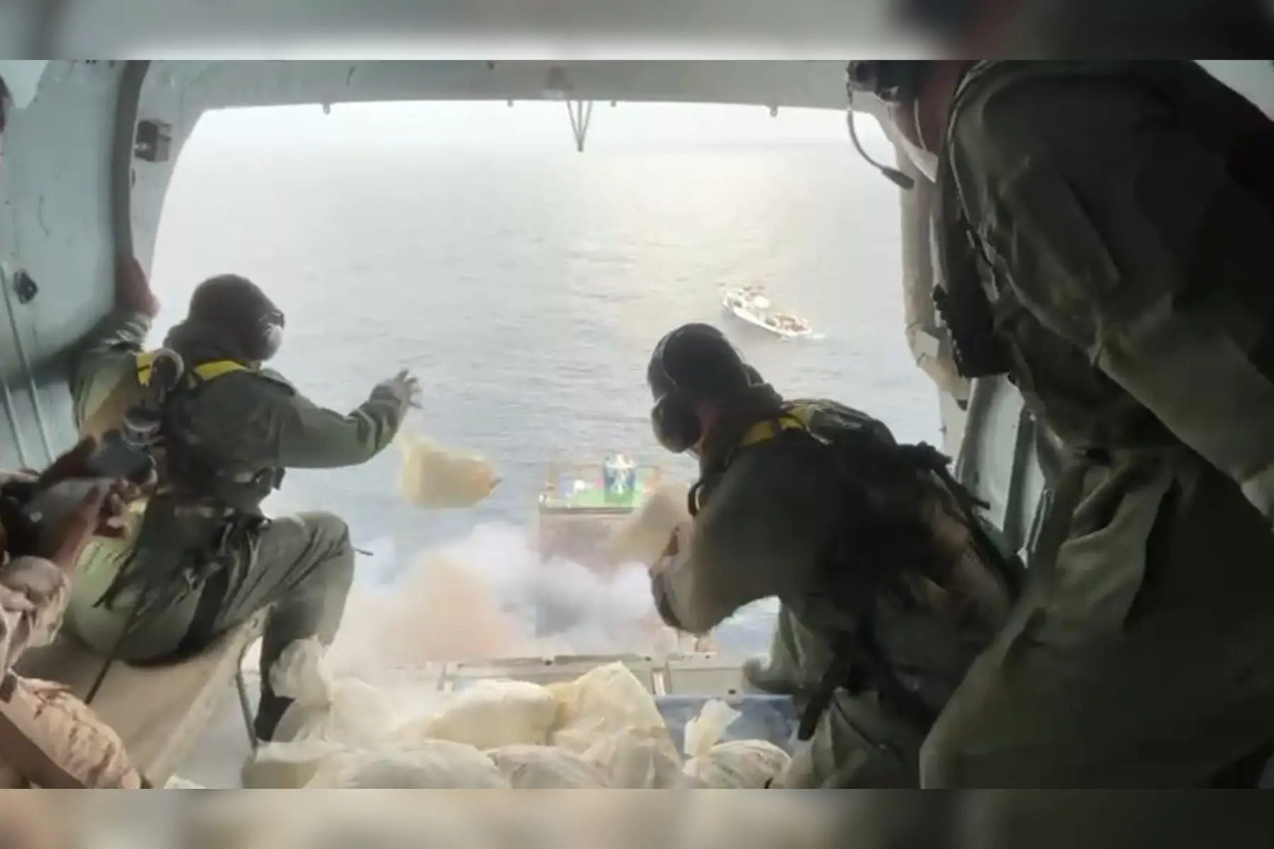 Navy authorities spray chemical substances from the aircraft to douse the flames | Screengrab
