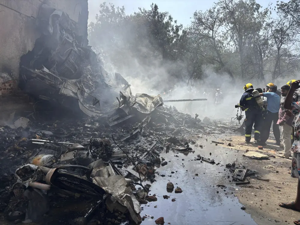 Firefighters work at the site of an airplane that crashed in India's northwestern city of Ahmedabad in Gujarat state | AP