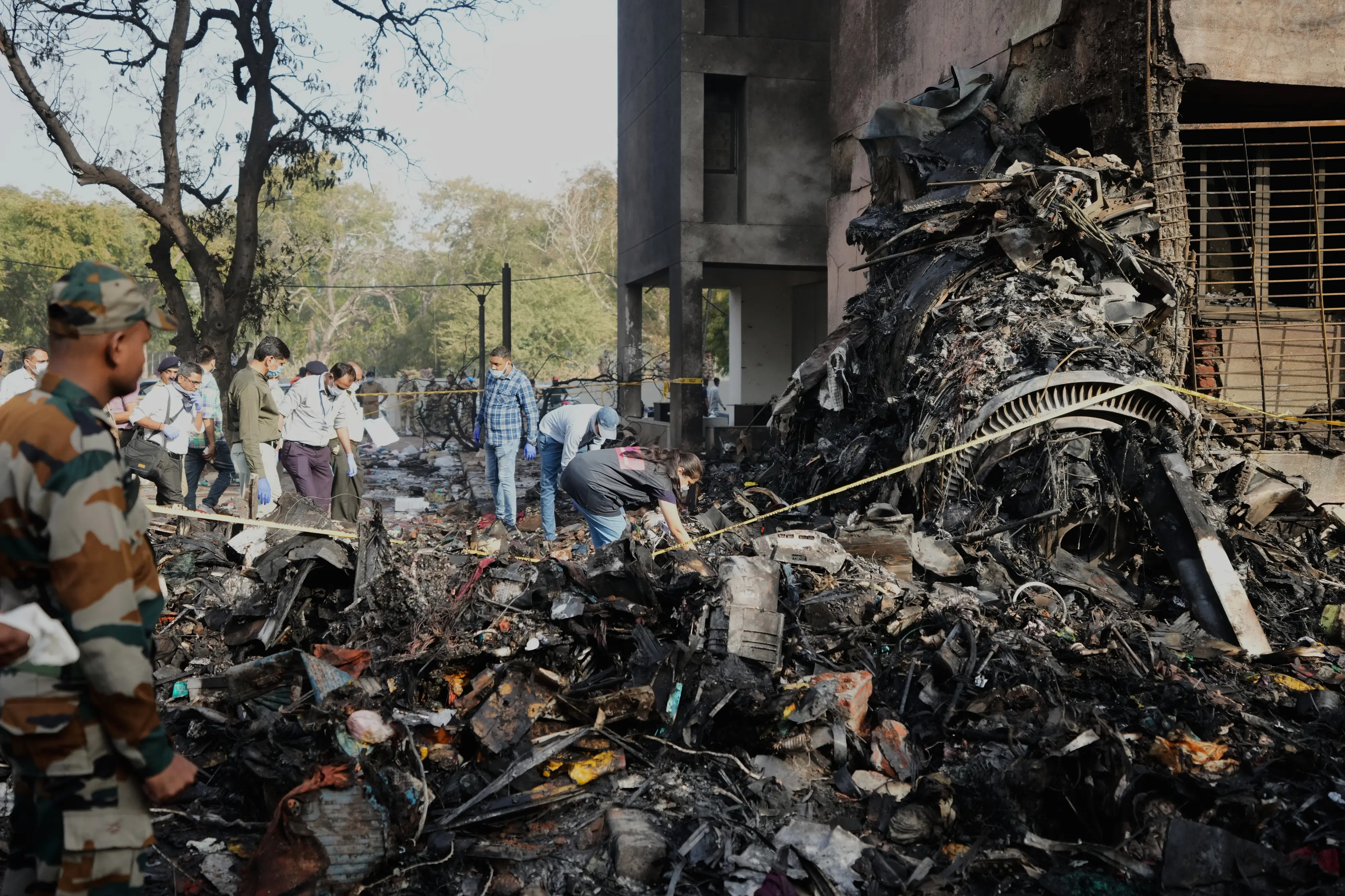 Rescuers work at the site of an airplane that crashed in Ahmedabad | AP