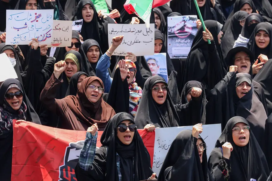 People gather for a protest against Israel's wave of strikes on Iran in central Tehran