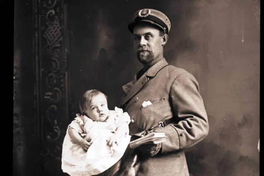 american postman with baby and letters