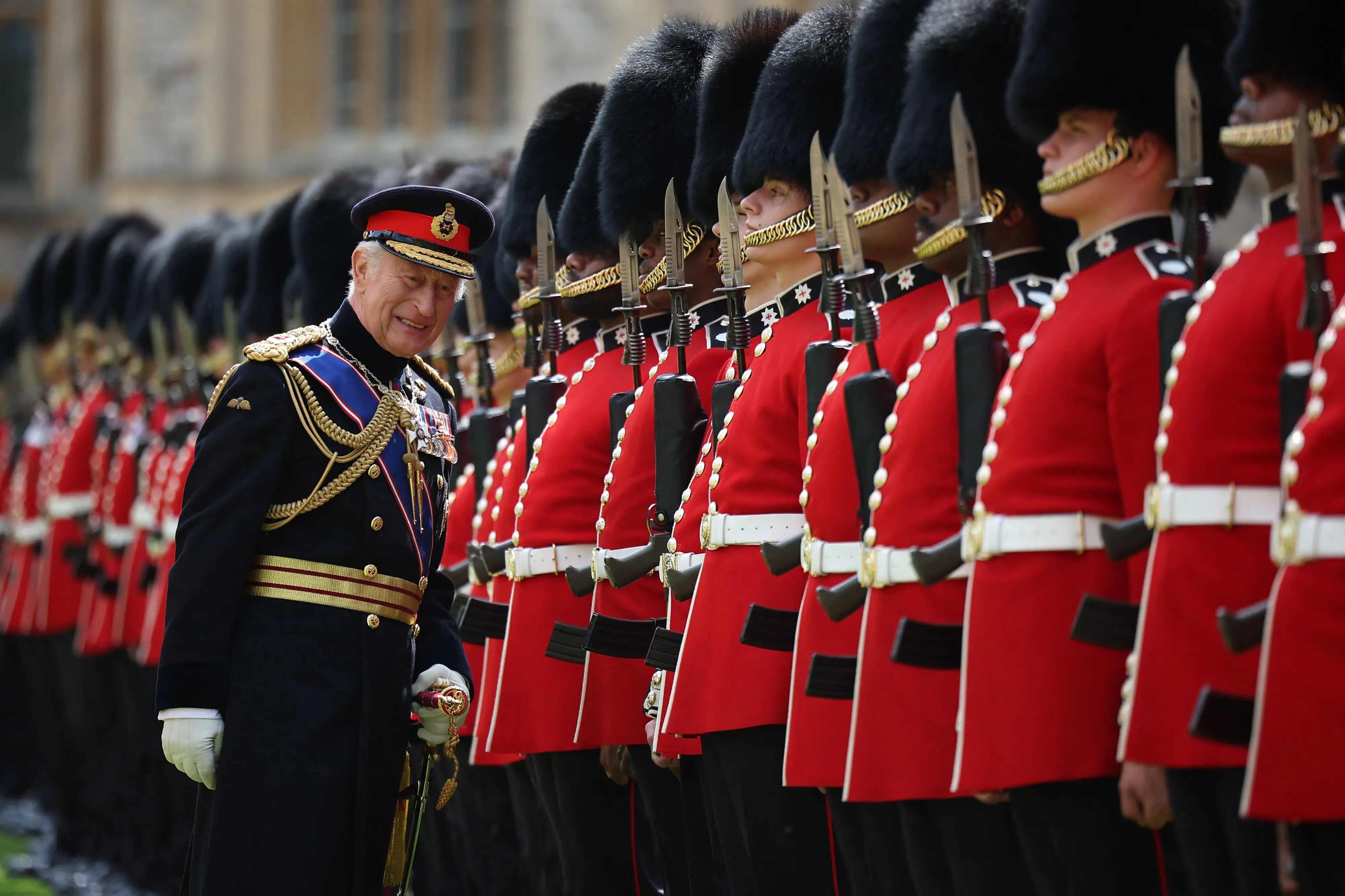Britain's King Charles III, Colonel in Chief of the Coldstream Guards inspects the regiment during a ceremony where he presents new Colours to the 1st and 2nd Battalion (Number 7 Company) the Coldstream Guards at Windsor Castle, west of London. | Photo: AFP