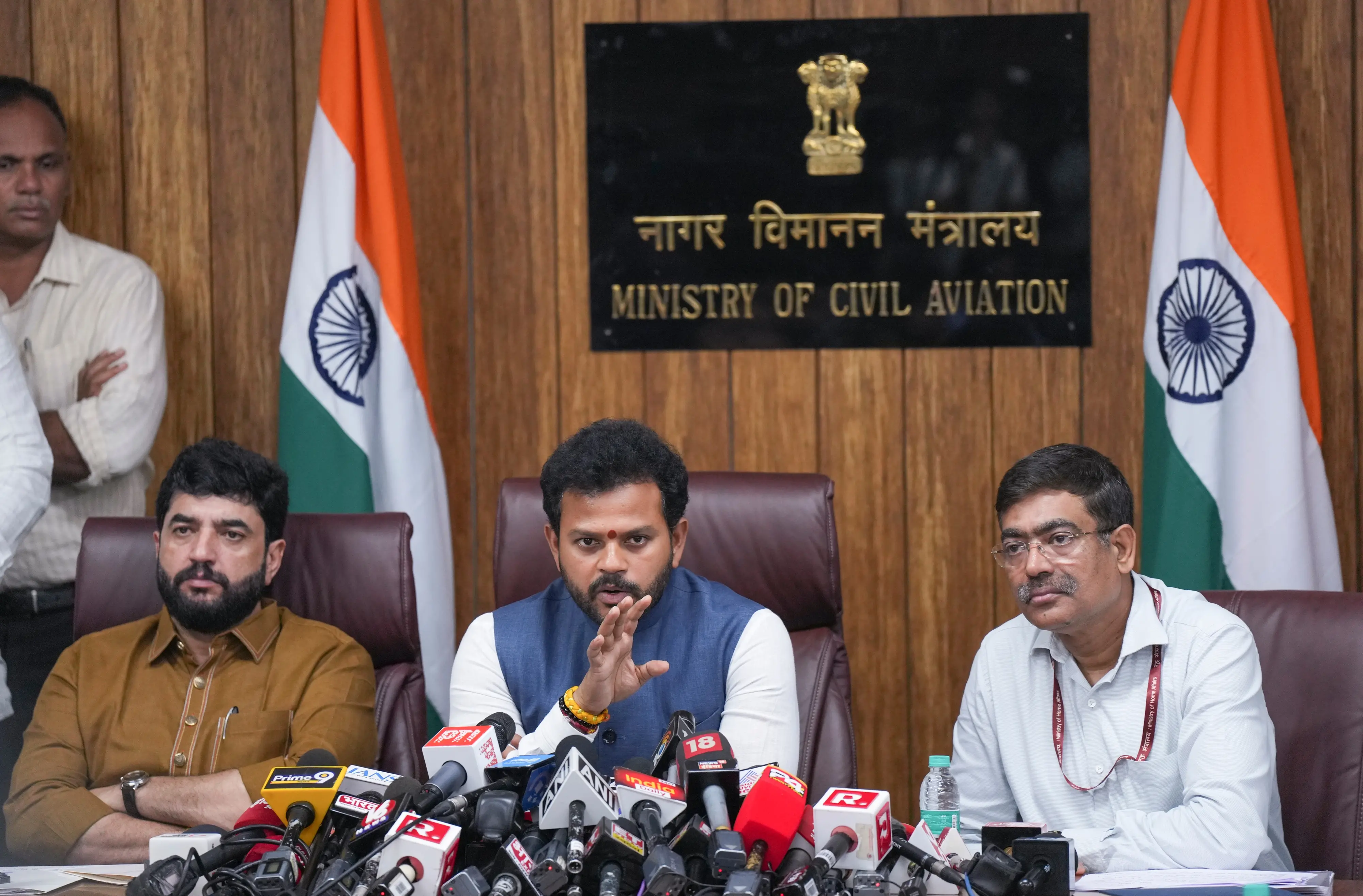 Civil Aviation Minister Rammohan Naidu with Minister of State for Civil Aviation Murlidhar Mohol and Ministry of Civil Aviation Secretary Samir Kumar Sinha addresses a press conference, in New Delhi. | PHoto: PTI