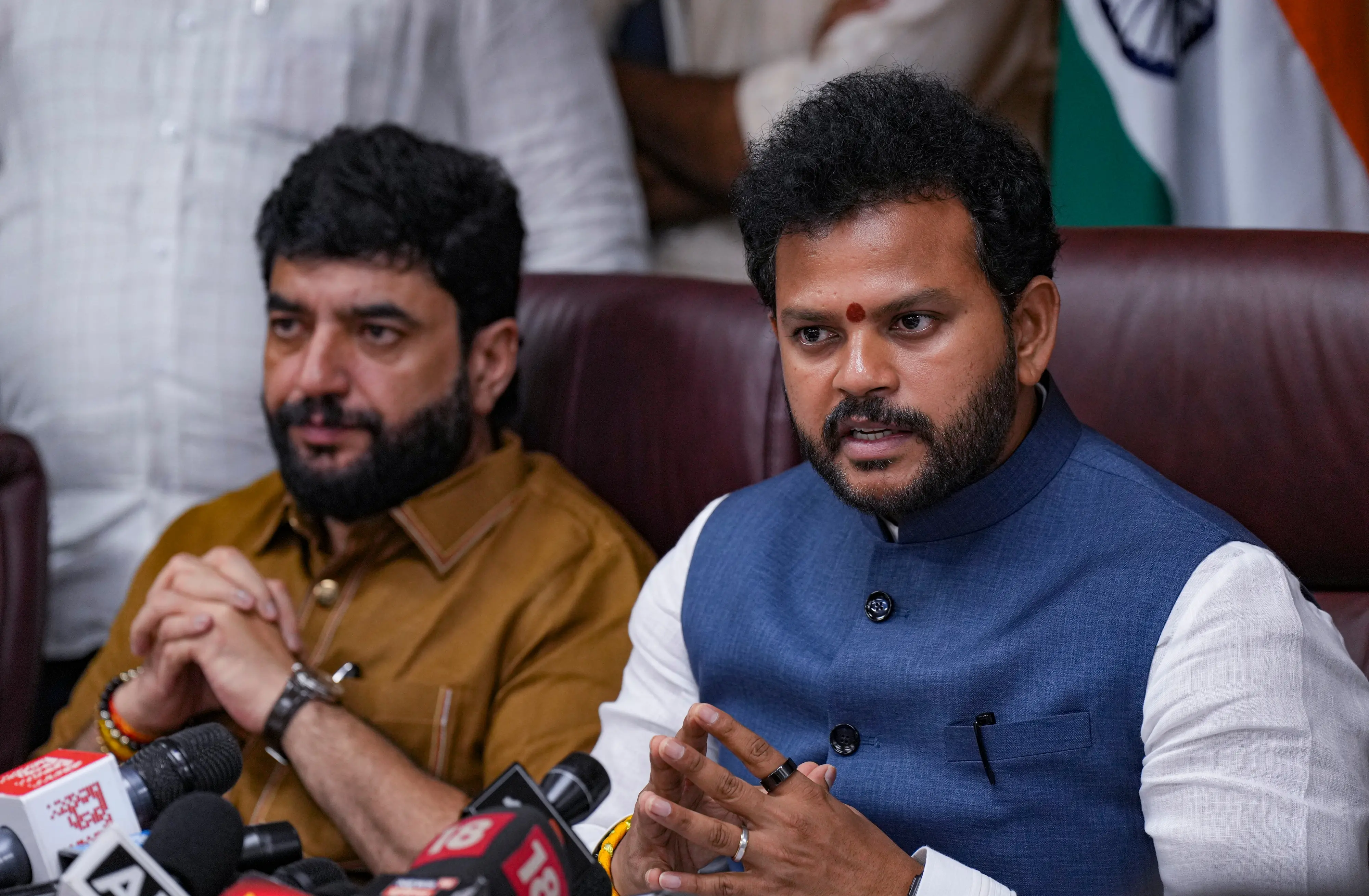 Civil Aviation Minister Rammohan Naidu with Minister of State for Civil Aviation Murlidhar Mohol addresses a press conference, in New Delhi. | Photo: PTI