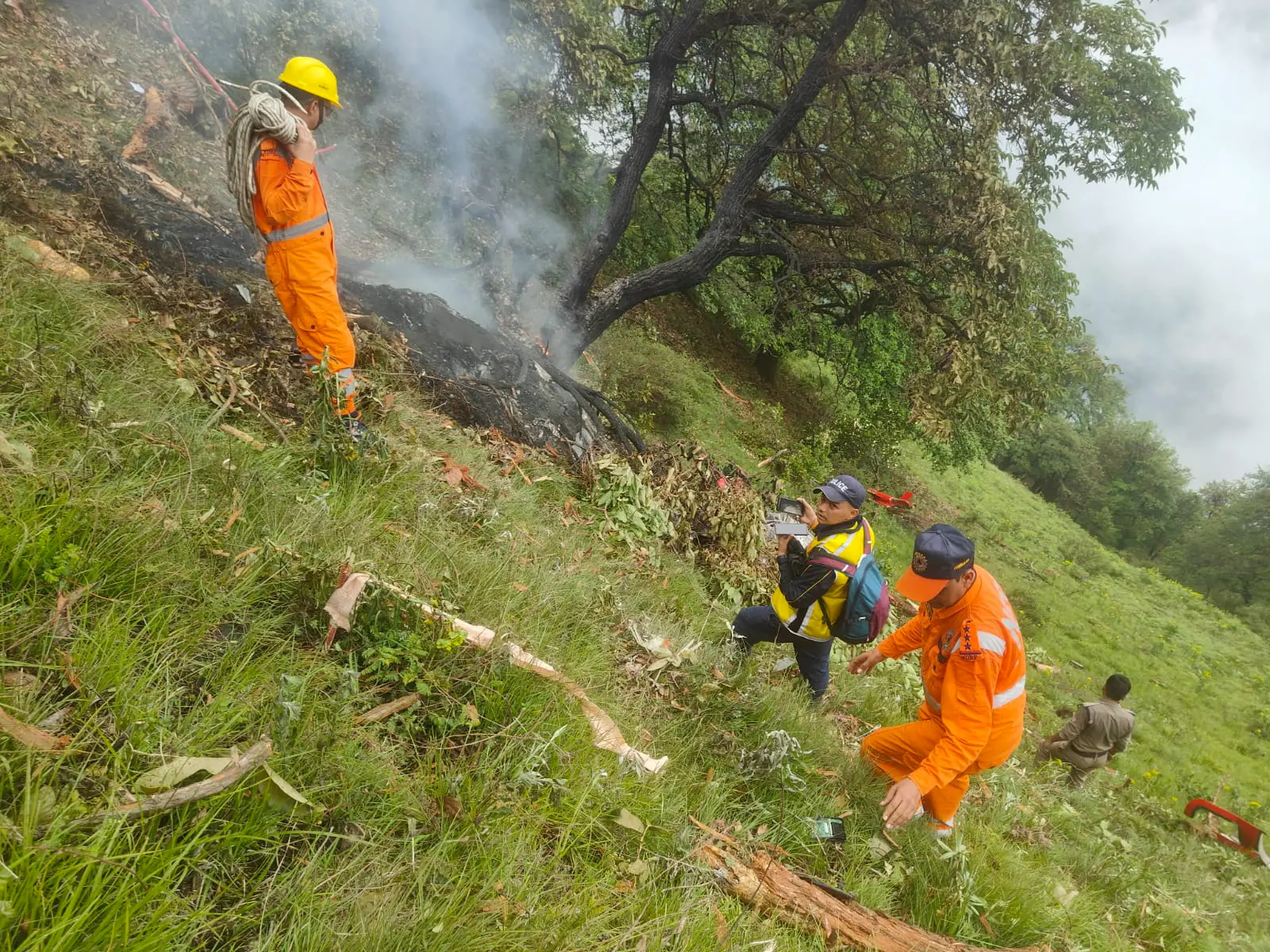 NDRF personnel at the spot after a helicopter crashed near the Kedarnath shrine, in Rudraprayag district, Uttarakhand. | Photo: PTI