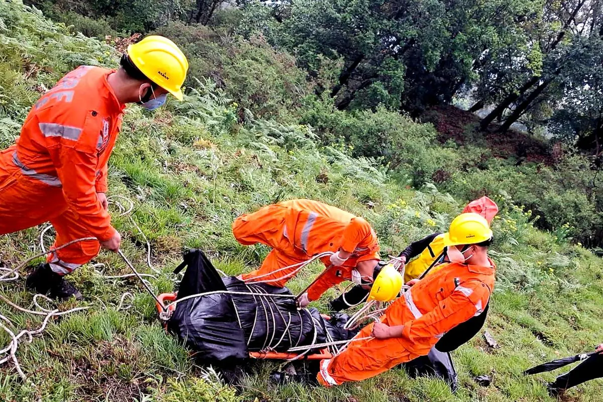 NDRF personnel at the spot after a helicopter crashed near the Kedarnath shrine, in Rudraprayag district, Uttarakhand | PTI