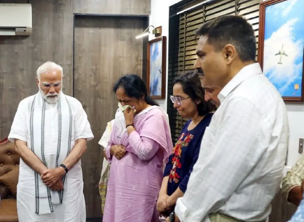 Prime Minister Narendra Modi consoles the family of former Gujarat CM Vijay Rupani, who lost his life in the AI-171 plane crash | ANI